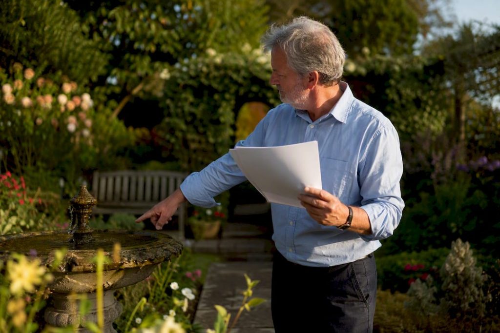 Landlord reviewing mortgage documents at home