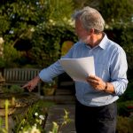 Landlord reviewing mortgage documents at home